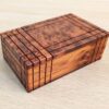Coffret en bois avec ouverture secrète et compartiment caché